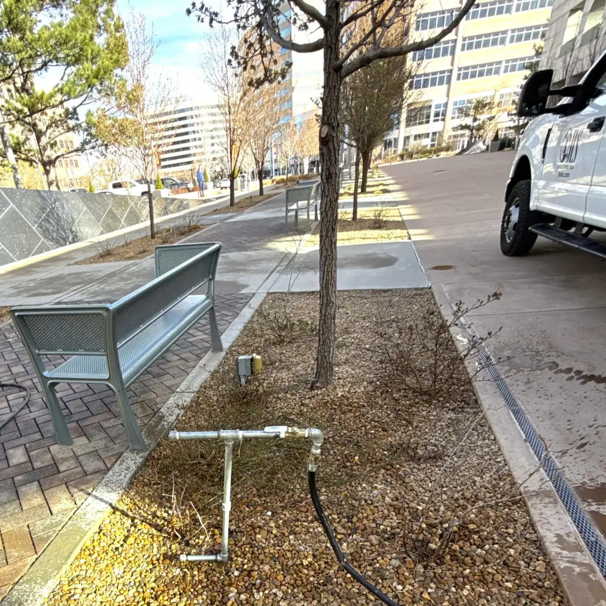JLS Landscape crew performing deep-root watering during Stage 1 drought in Colorado
