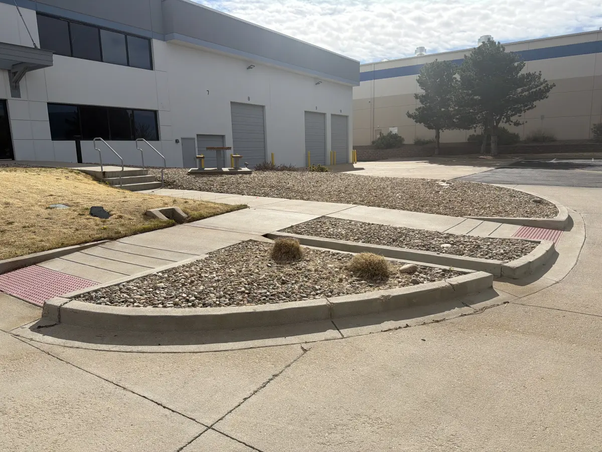 Decorative rock landscaping maintained by JLS in Colorado