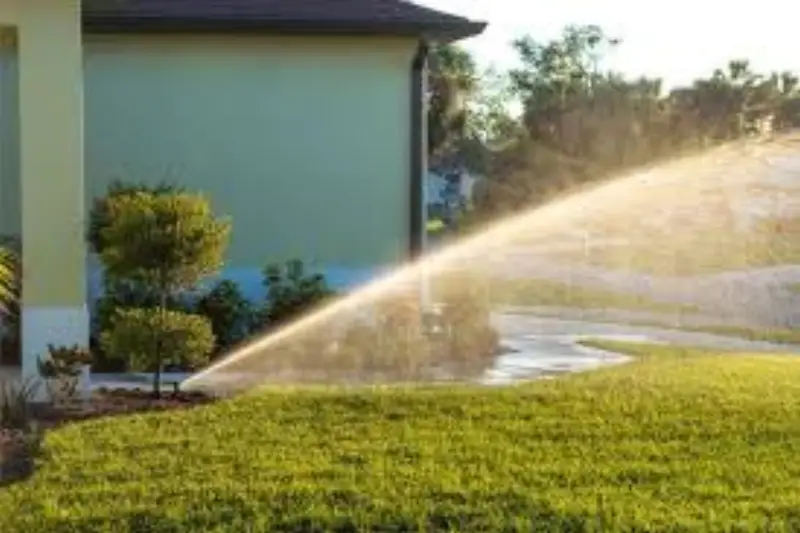 Irrigation sprinkler watering commercial landscape in Denver