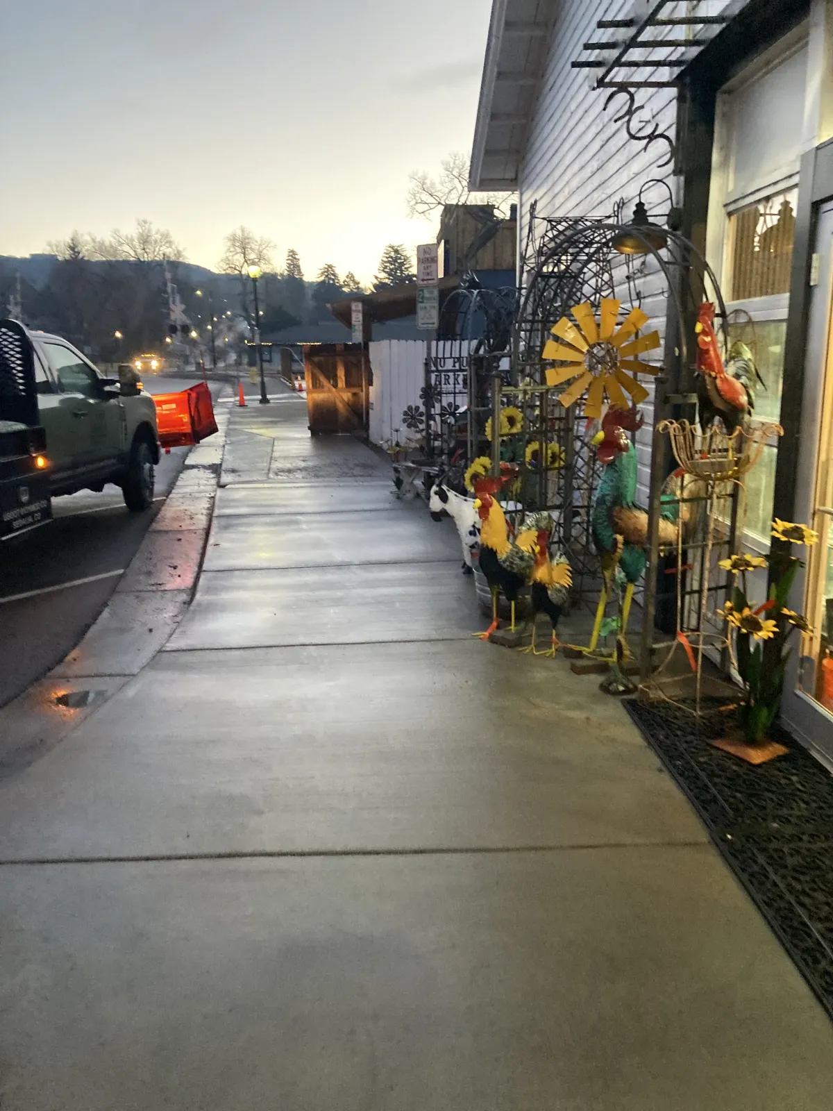 JLS Landscape branded truck in snow clearing operations in Denver