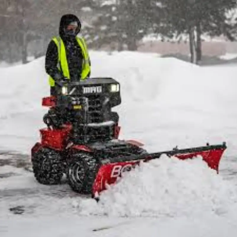 Snow removal crew operating equipment during a Denver storm