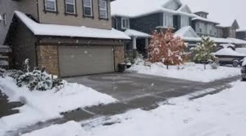 JLS snow plowing operations on a commercial parking lot