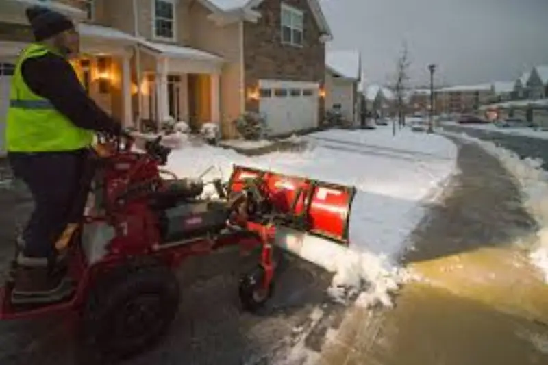 JLS snow management team clearing a Douglas County lot