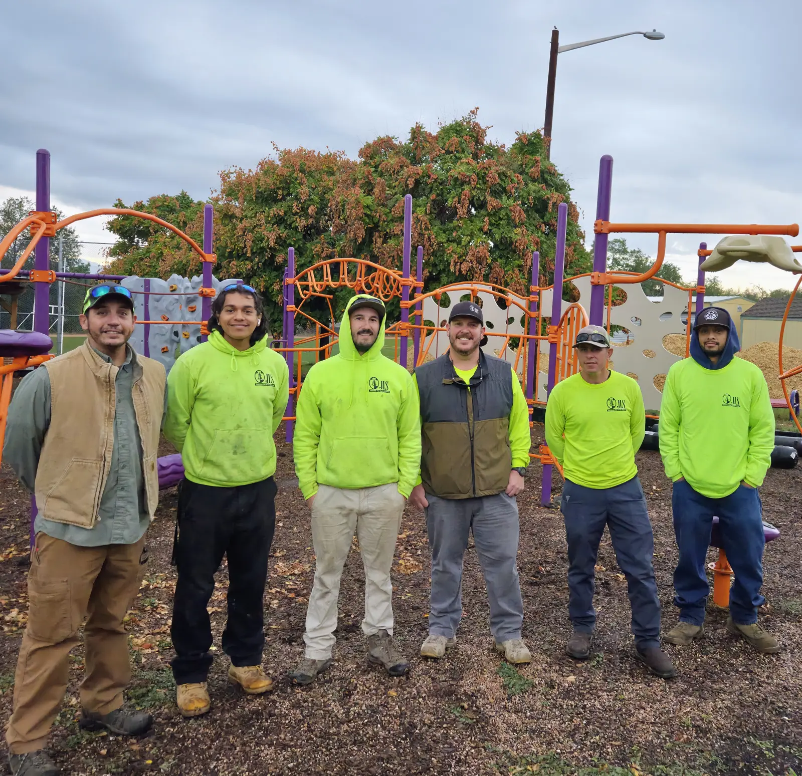 JLS Landscape crew in branded uniforms at community event